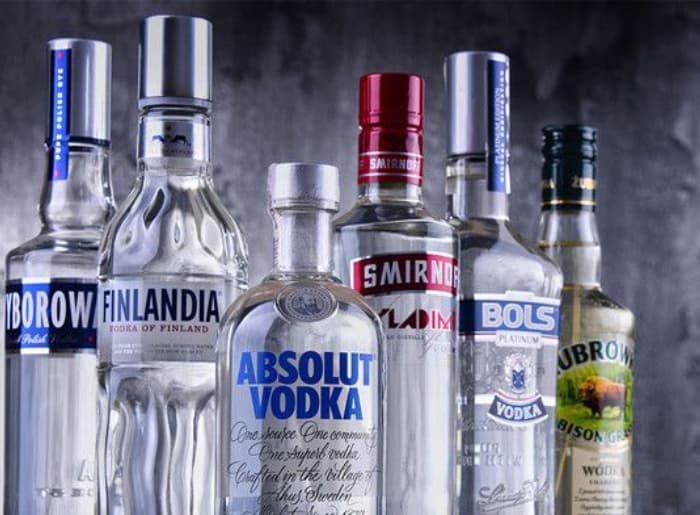 Flavoured vodka and regular vodka bottles compared for alcohol content, sugar and labeling differences