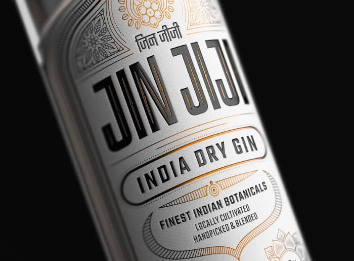 Premium gin bottles with juniper berries, citrus peel and botanical ingredients