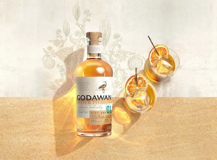 Five Indian single malt whisky brands that rival international whiskies, including Godawan, Amrut, Rampur, Paul John, and Crazy Cock.