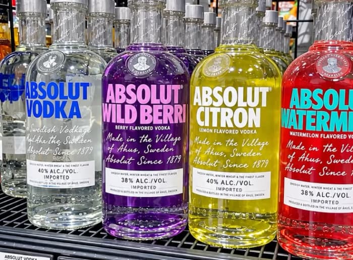 Flavoured vodka and regular vodka bottles compared for alcohol content, sugar and labeling differences